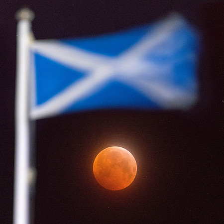 Blood moon and the flag of  Portencross castle