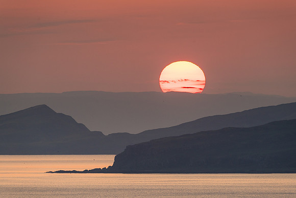Sun setting over Little Cumbrae and the Isle of Bute.